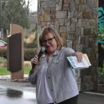 Sequim Gazette photo by Matthew Nash/ Executive Director Vickie Maples speaks to a crowd on March 23 during the royalty float unveiling.