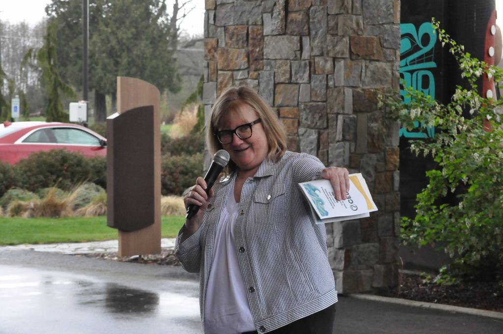 Sequim Gazette photo by Matthew Nash/ Executive Director Vickie Maples speaks to a crowd on March 23 during the royalty float unveiling.