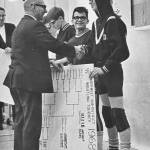 Photo courtesy of Randy Tomaras / Young Randy Tomaras, right receives honors from his father William at a wrestling tourney.