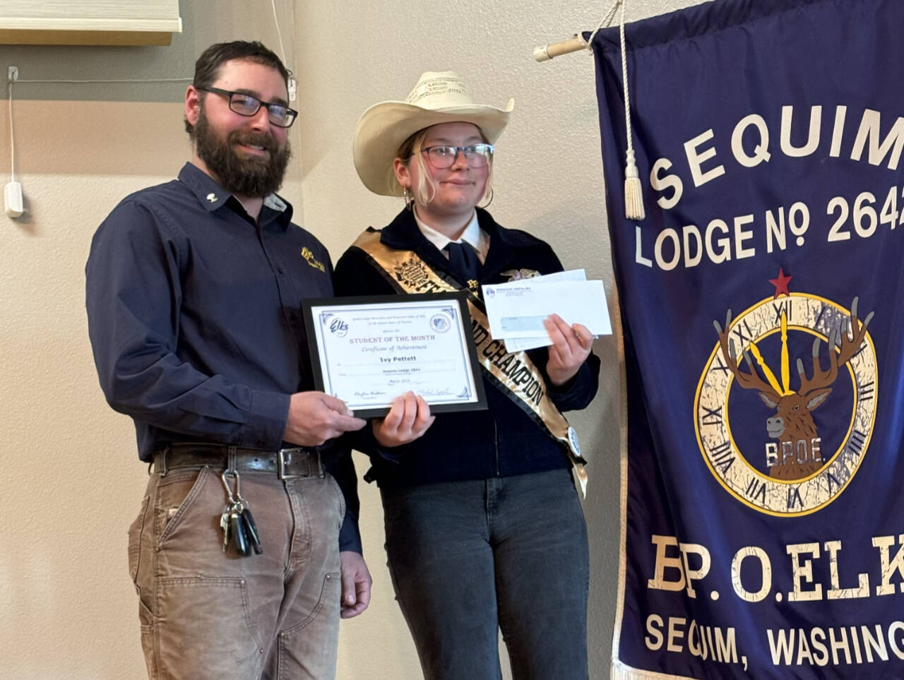 Photo courtesy of Sequim Elks Lodge
Sequim High student Ivy Pettit accepts her Sequim Elks Lodge Student of the Month award from Sequim Elks Exalted Ruler Klayton Waldron.