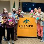 Photo courtesy Olympic Medical Center
Sunbonnet Sue Quilt members were honored by Olympic Medical Center on March 6 for their contributions of thousands of Joy Quilts to child patients since 2000. Some of the participating quilters are, from left, Loretta Bilow, Jean Marie McDonald, Bernadette Shein, Chris McDonald, Jan Johannessen, Bonnie Cauffman, Marianne Ballard, and Stephanie Swensson.