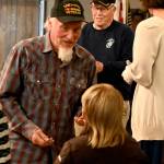 Sequim Gazette photo by Michael Dashiell / Vietnam War veteran Donald Pitkin, who served in the U.S. Army in 1968 and 1969, receives a commemorative pin and thanks from Junior American Eagles Donnie (8) and Henry (10) Fors at a ceremony honoring veterans on March 27.