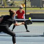 Sequim Gazette photo by Michael Dashiell / Patricia Knapp, center, of the X-40 Kraken looks to get a shot past Jennifer Cox and Tim Scott of the Lavender Lobbers in a Sequim Picklers Minor League Pickleball match last week.