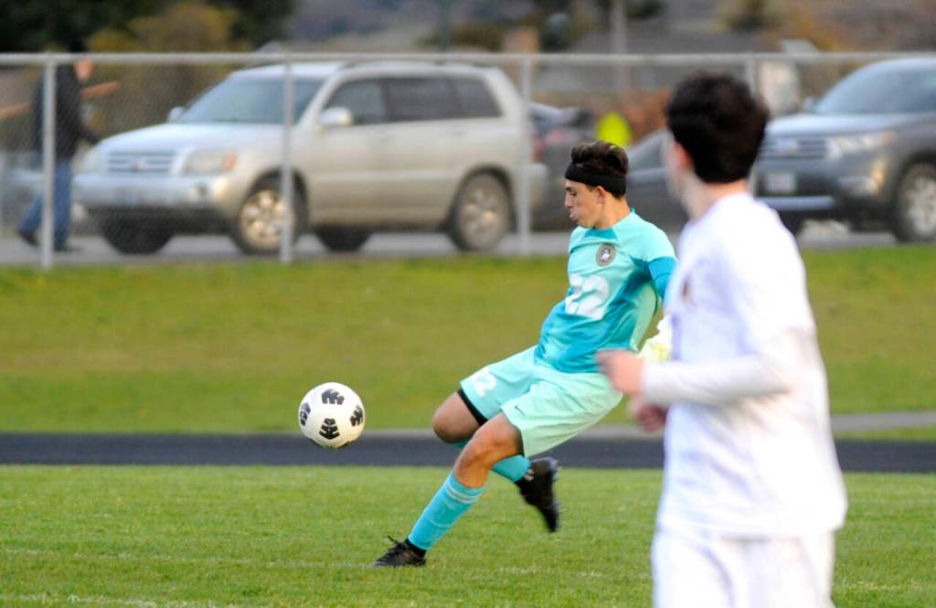 Sequim Gazette photo by Michael Dashiell / Sequim goalkeeper Nolan Valenzuela boots the ball downfield in the first half of SHSs 3-2 loss to visiting Bainbridge on March 26.