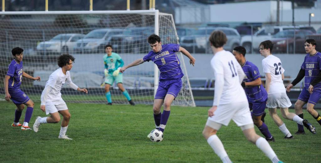 Sequim Gazette photo by Michael Dashiell / Sequims Colin Feik, center, looks to keep possession as hes surrounded by Bainbridge players in the Wolves home game against the Spartans on March 26.