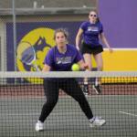 Sequim Gazette photo by Michael Dashiell / Sequims Sydney Hegtvedt, left, awaits a return volley as she and Dani Herman take on Bainbridges Malia Lemiux and Katherin Walker in an Olympic League match on April 9 in Sequim.