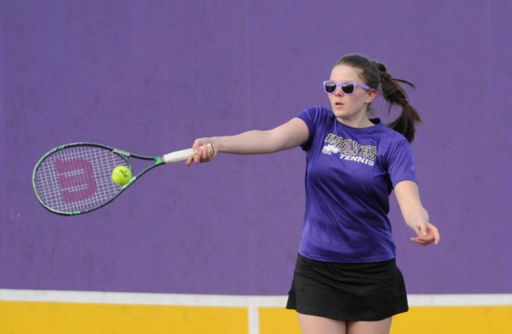 Sequim Gazette photo by Michael Dashiell / Sequims Dani Herman returns a shot in her first match of the season after returning from an offseason injury, as she and doubles partner Sydney Hegtvedt take on Bainbridges Malia Lemiux and Katherin Walker in an Olympic League match on April 9 in Sequim.
