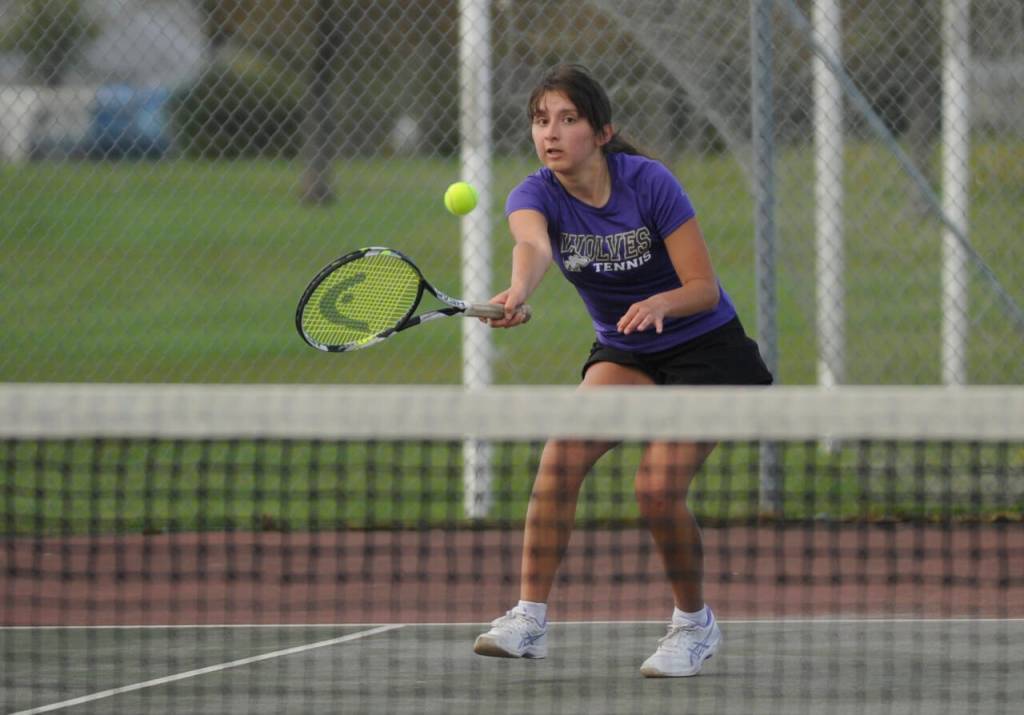 Sequim Gazette photo by Michael Dashiell / Sequims Amara Gonzalez returns a shot against Bainbridges Gabby Farley in an April 9 Olympic League match.