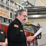Sequim Gazette photo by Michael Dashiell / At a March 27 ceremony in Sequim, Fire District 3 deputy chief Tony Hudson details the work of outgoing District 3 chief Ben Andrews, as District3 chief Justin Grider listens.