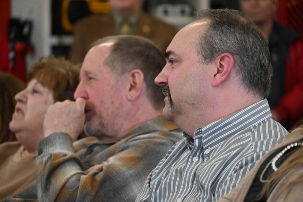 Sequim Gazette photo by Michael Dashiell / Outgoing Fire District 3 chiefs Dan Orr, left, and Ben Andrews listen as they are lauded by colleagues at a March 27 ceremony in Sequim.