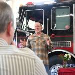 Sequim Gazette photo by Michael Dashiell / Dan Orr thanks colleagues, family and friends as he and fellow outgoing Fire District 3 chief Ben Andrews (foreground) are lauded at a March 27 ceremony in Sequim.