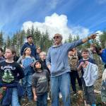 Sequim Gazette photo by Matthew Nash/ Volunteer Wayne Fitzwater talks to third graders about foresters efforts to manage trees and keep forests healthy in the Sequim area.