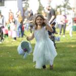 Sequim Gazette photo by Michael Dashiell / Ivory Lyckman, 5, of Sequim, joins dozens of youths in a grand search for eggs at the Sequim Elks Lodge Easter Egg Hunt on March 30.