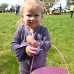 Sequim Gazette photo by Michael Dashiell / Penelope Wheeler of Agnew, who turns 2 in May, shows off one of her treasures collected at the Sequim Elks Lodge Easter Egg Hunt on March 30.