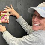 Photo courtesy of Peninsula Fiber Artists
Port Townsend artist Annie Karl hangs her Transporter Malfunction miniature during installation of the Funky Ladies 24/7 exhibit at 675 Tyler St., Port Townsend.
