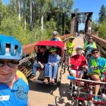 Photo courtesy of Sequim Wheelers / Sequim Wheelers, pictured here on the historic Railroad Bridge near the Dungeness River Nature Center, prep for a ride on the Olympic Discovery Trail. The nonprofits season begins in May, and has an open house for potential new volunteers on April 20 at the River Center, and a new volunteers orientation on April 25, also at the River Center.