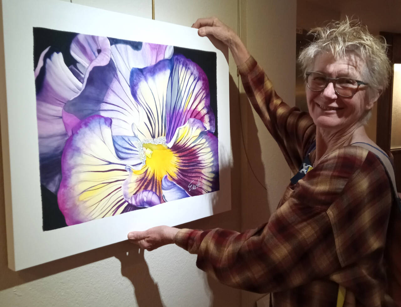 Photo courtesy of Peninsula Fiber Artists
Sequim artist Susan Melka, pictured here hanging a piece by Evette Allerdings, is one of 18 regional textile artists to be exhibited in Color Play.