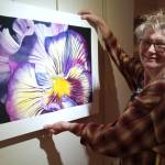 Photo courtesy of Peninsula Fiber Artists
Sequim artist Susan Melka, pictured here hanging a piece by Evette Allerdings, is one of 18 regional textile artists to be exhibited in Color Play.