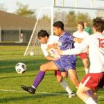 Sequim Gazette photos by Michael Dashiell
Sequims Mekhi Ashby, center, looks to push through the Kingston defense in the first half of an April 9 Olympic League match-up.