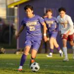 Sequims Guillermo Salgado looks for a teammate in the first half of the Wolves April 9 home game against Kingston.