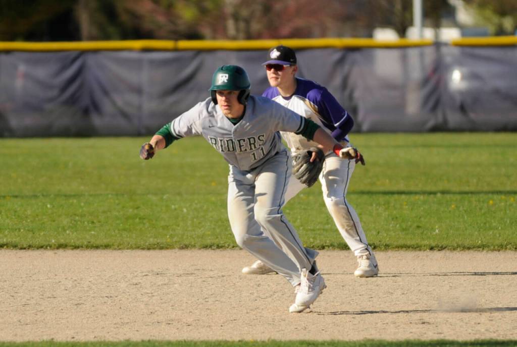 Sequim Gazette photo by Michael Dashiell / Sequim shortstop Devyn Dearinger keeps an eye on Port Angeles baserunner Josiah Gooding in the Wolves 7-4 Olympic League loss on April 12.