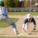 Sequim Gazette photos by Michael Dashiell
Sequims Bryant Laboy dives back to first base as Port Angeles first baseman Rylan Politika awaits a throw in SHSs 7-4 home loss to the Roughriders on April 12. Laboy was 2-for-4 with a double and RBI in the contest.