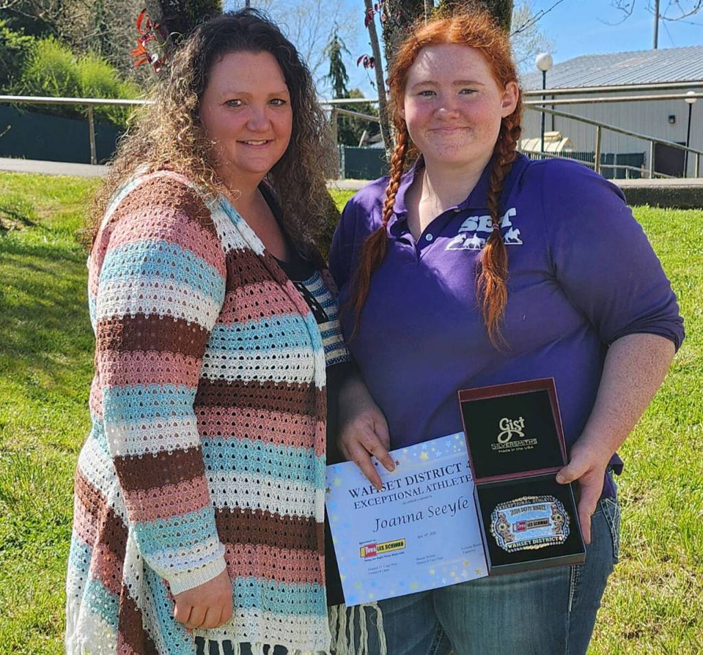 Photo courtesy of Sequim Equestrian Team / Joanna Seeyle, right, celebrates her District 4 Exceptional Athlete Award with mom Candy Seelye.