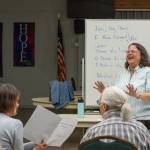 Photo by Emily Matthiessen / Joan Reeve Owens, interim conductor with the Peninsula Singers, helps lead a rehearsal in early April. The group hosts their spring concert on Sunday, April 28, at Trinity United Methodist Church.