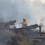Sequim Gazette photo by Matthew Nash
Clallam County Fire District 3 firefighters helped Department of Natural Resources firefighters to initially contain a slash pile fire that spread due to wind on April 15.