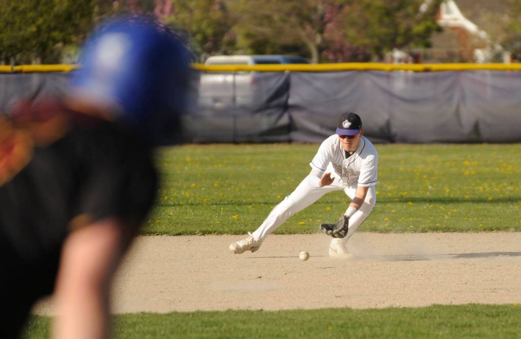 Sequim Gazette photo by Michael Dashiell / Sequim shortstop Devyn Dearinger sizes up a grounder and looks to throw out a Kingston batter in an April 19 Olympic League game.