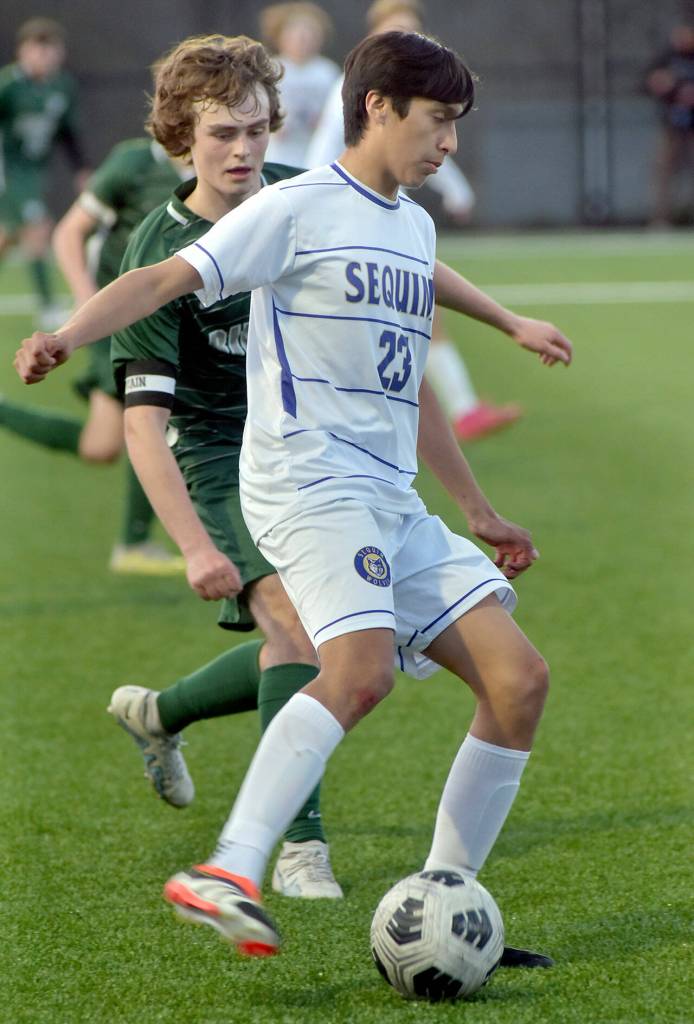 Photo by Keith Thorpe/Olympic Peninsula News Group / Sequims Guillermo Salgado, front, cuts in front of Port Angeles Grant Butterworth on April 16 in Port Angeles.