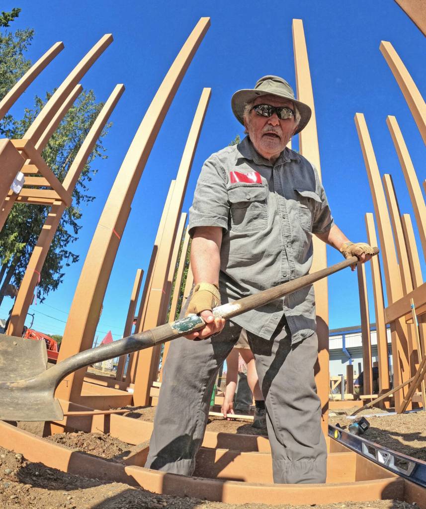 Photo by Jay Cline / John Brewer, former editor of the Peninsula Daily News and publisher of the PDN, Sequim Gazette and the Forks Forum, and other volunteers help rebuild the Dream Playground in Port Angeles. Brewer died while on a fishing trip in Montana last week.