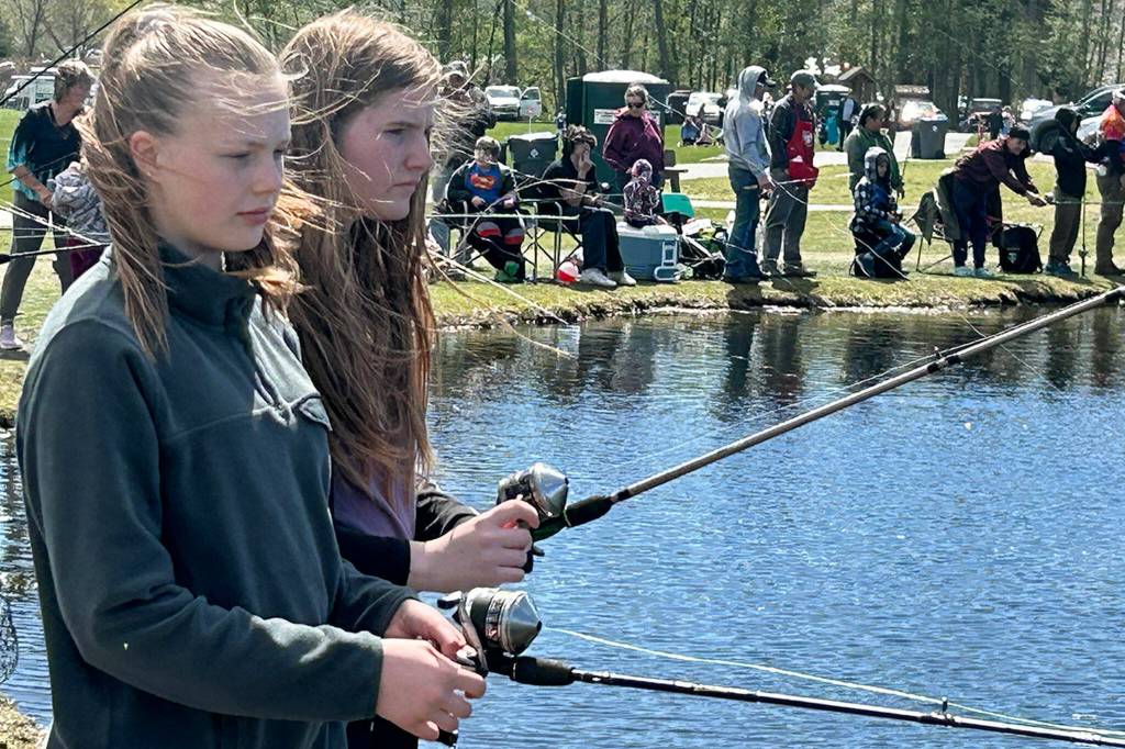 Grace Dormer, and Zoei McCullem, both 13 and from Sequim, cast lines out for fish on Kids Fishing Day. The friends said theyve both attended the event before.