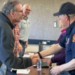 Sequim Gazette photo by Matthew Nash/ Clallam County Fire District 3 fire commissioners Mike Mingee, Jeff Nicholas, and Bill Miano congratulate Blaine and Cindy Zechenelly and the Community Emergency Response Team (CERT) for its continued success in supporting the community.