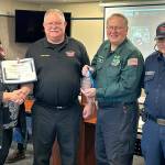 Sequim Gazette photo by Matthew Nash
The Sequim areas Community Emergency Response Team (CERT) program received the volunteer service award for its efforts last year. Presenting the award on April 16, was Diane Klontz, deputy director for Division and Program Alignment with the Washington State Department of Commerce, to, from second left, Clallam County Fire District 3 Fire Chief Justin Grider, Charles Meyer, a CERT division chief, who nominated the program for the award, and CERT Senior Program Manager Blaine Zechenelly.