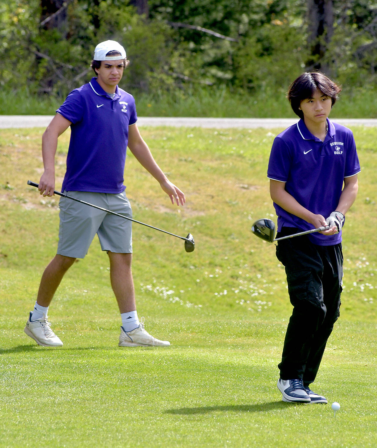 Photo by Keith Thorpe/Olympic Peninsula News Group / Sequims Lars Wiker, left, and Joey Kang look down the first fairway before teeing off at the Duke Streeter Invitational at Peninsula Golf Course in Port Angeles on April 23.