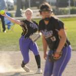 Sequim Gazette photo by Michael Dashiell / Sequim third baseman Ava Ritter throws out a Bremerton runner in an April 23 Olympic League match-up in Sequim. In the foreground is SHS pitcher Taylee Rome.
