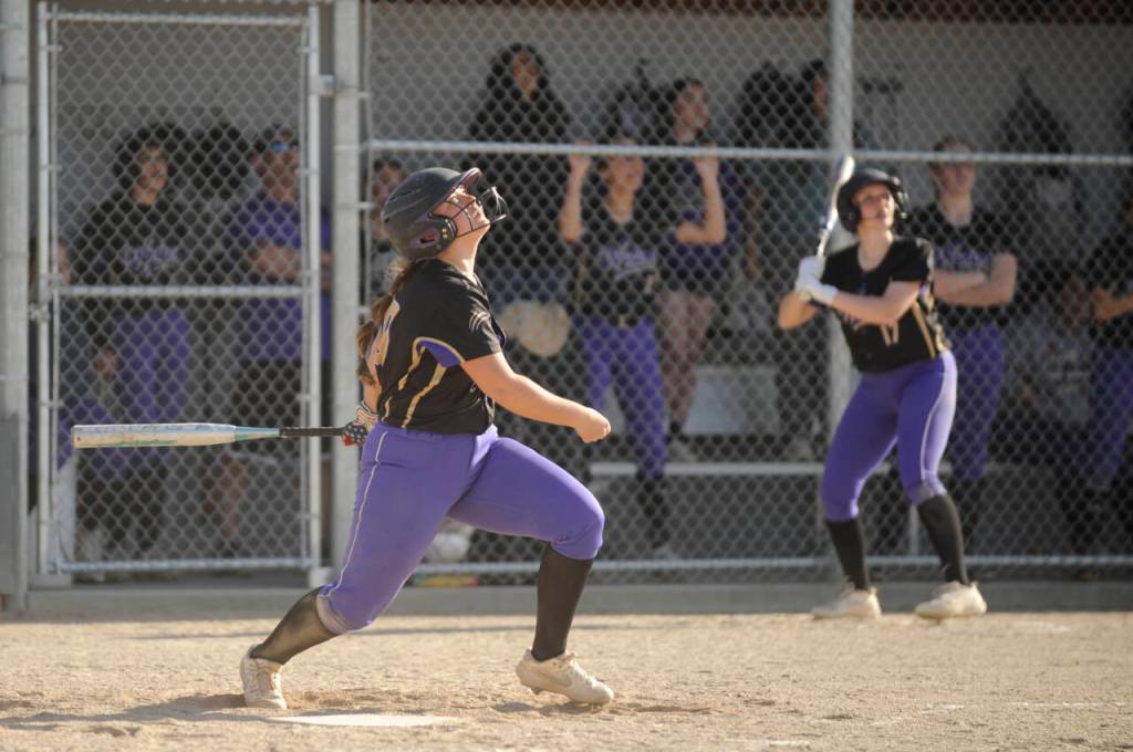 Sequim Gazette photo by Michael Dashiell / Sequims Mikki Green watches as her pop fly turns into a single in the Wolves Olympic League game against Bremerton on April 23.