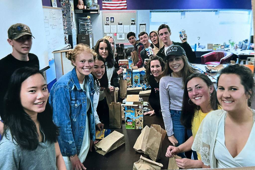 Photo courtesy Chelsea Reichner/ Alissa Lofstrom, far right, and other students and staff at Sequim High School make snack bags for Advanced Placement testing in 2019.