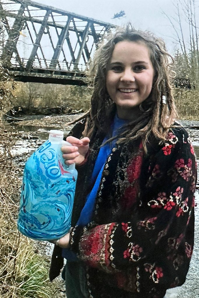 Photo courtesy Chelsea Reichner/ Alissa Lofstrom holds a water jug she painted for the Walk for Water event with the Interact Club at Sequim High School. A new mural was finished by Sequim students after Covid-19 prevented Lofstrom from finishing it in 2020.