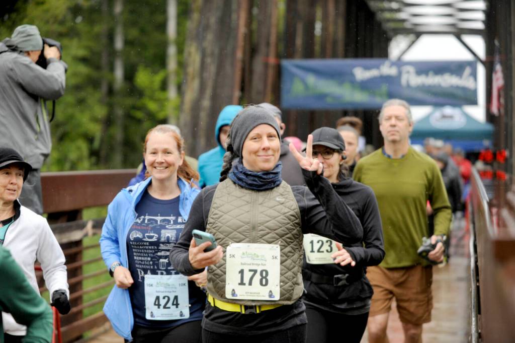 Kathryn Johnson of Oak Harbor (424), Sarah Wilson of Port Orchard (178) and Christine Thurston of Gig Harbor (123) take off at the beginning of the Sequim Railroad Bridge Run on April 27.