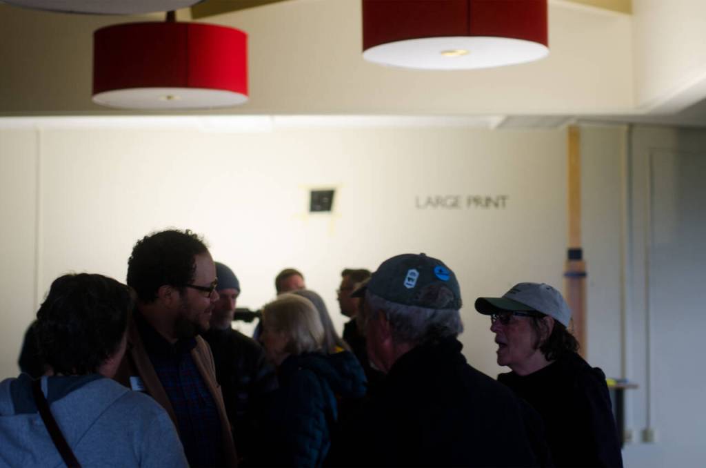 Sequim Gazette photo by Elijah Sussman / Attendees of the Sequim Library expansion project groundbreaking on April 24 talk with North Olympic Library System staff and project partners inside the structure on North Sequim Avenue.