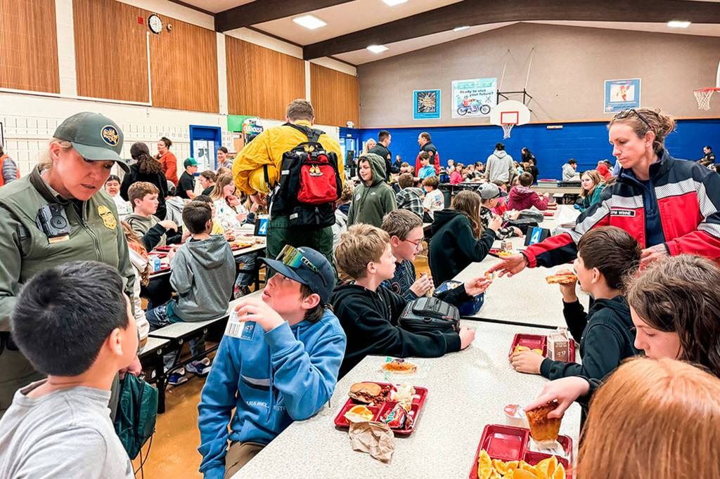 Photo courtesy Sequim Elementary PTA/ First responders from the U.S. Border Patrol, Clallam County Fire District 3 and others joined fifth graders at Helen Haller Elementary on April 26 to discuss their jobs for Friend a First Responder Day.