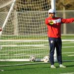 Sequim Gazette photo by Michael Dashiell / North Peninsula Football Club coach Juan Carlos Cisneros explains a drill to Christina Dalton and NPFC players at a practice in Port Angeles on May 7.
