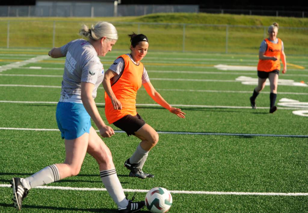 Sequim Gazette photos by Michael Dashiell
Jessica Haugen battles teammate Aimee Dennis for possession in a scrimmage at a North Peninsula Football Club practice in Port Angeles on May 7.