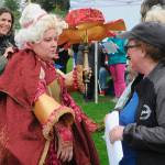 Marissa Meek, wearing You light up my life at the second Trashion Show, speaks with judge Jennifer Rose with Around Again as fellow judge Emily Underwood with Over the Fence looks on. Meek said her mother had some old, unused lamp shades and she loved how decedent they felt. She plans to use the cloak in a film shes making for a class at Peninsula College.