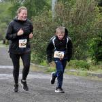 Sequim Gazette photo by Matthew Nash/ Mother and son Stef and Mason Anderson, 8, of Sequim look to finish the 5K with the Sequim Irrigation Festivals Run Series. Mason said hed consider running it again but hed need to keep practicing on a treadmill.