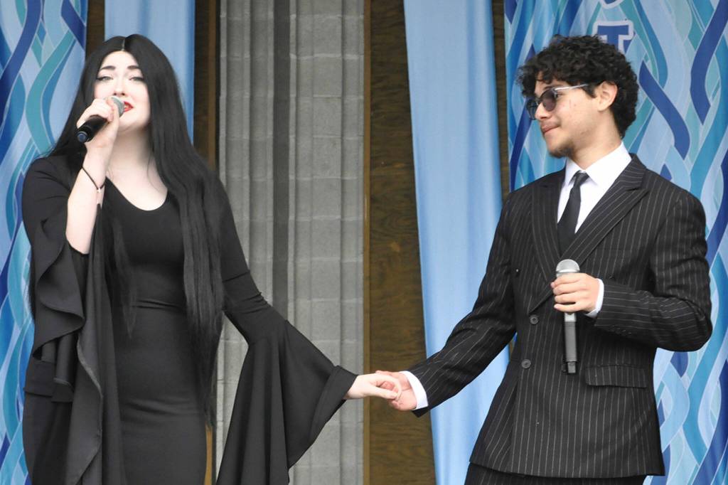 Ava Fuller and Ozzie Hernandez as Morticia and Gomez sing with the ensemble the opening number of The Addams Family operetta on May 4 during the Irrigation Festivals Family Fun Days. The show runs May 9-11 at 7 p.m. in Sequim High Schools auditorium.