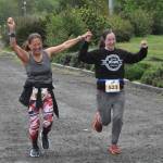 Mother-daughter runners Julia of Sequim and Jennifer King of Kent finish the 5K in Carrie Blake Community Park on May 4 as part of the Sequim Irrigation Festivals Run Series. They said it was their first time participating in the event, and Jennifer suggested it as she was looking for 5K events to run with her mom.