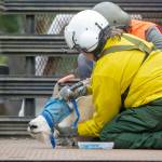 File photos by Jesse Major/Olympic Peninsula News Group
Patti Happe, Olympic National Park wildlife branch chief, holds down a goat in the back of a truck in 2019.